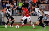 Manchester United's Jesse Lindgard, center, challenges for the ball with Partizan's Bojan Ostojic during the Europa League group L soccer match between Partizan Belgrade and Manchester United at the Partizan stadium in Belgrade, Serbia, Thursday, Oct. 24, 2019. (AP Photo/Darko Vojinovic)