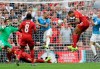 Liverpool's Joel Matip, second from right, scores his side's first goal during the English Community Shield soccer match between Liverpool and Manchester City at Wembley stadium in London, Sunday, Aug. 4, 2019. (AP Photo/Kirsty Wigglesworth)