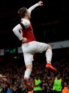 Arsenal's Aaron Ramsey celebrates after scoring his side's third goal during the English Premier League soccer match between Arsenal and Fulham at Emirates stadium in London, Tuesday, Jan. 1, 2019. (AP Photo/Kirsty Wigglesworth)