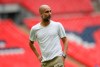 Manchester City's manager Pep Guardiola walks on the pitch after the English Community Shield soccer match between Liverpool and Manchester City at Wembley stadium in London, Sunday, Aug. 4, 2019. (AP Photo/Kirsty Wigglesworth)