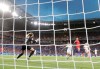 United States' Alex Morgan, right, scores her side's second goal, during the Women's World Cup semifinal soccer match between England and the United States, at the Stade de Lyon, outside Lyon, France, Tuesday, July 2, 2019. (AP Photo/Alessandra Tarantino)