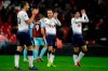 Tottenham Hotspur's Christian Eriksen, center, joined by Harry Kane, left, and Son Heung-min, right applaud at their fans after winning the match of the English Premier League soccer between Tottenham Hotspur and Burnley 1-0 at Wembley stadium in London, Saturday, Dec. 15, 2018. (AP Photo/Matt Dunham)