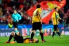 AEK's Ezequiel Ponce gives support to AEK's Uros Cosic lying in the pitch in dejection after defeat at the Champions League group E soccer match between Benfica and AEK Athens at the Luz stadium in Lisbon, Wednesday, Dec. 12, 2018. (AP Photo/Armando Franca)
