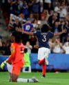 France's Wendie Renard, right, celebrates after scoring the opening goal against Nigeria goalkeeper Chiamaka Nnadozie during the Women's World Cup Group A soccer match between Nigeria and France at the Roazhon Park in Rennes, France, Monday, June 17, 2019. (AP Photo/Vincent Michel)