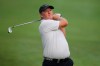 Marcus Fraser of Australia plays his shot on the 10th hole at the Malaysia Golf Championship Round One in Kuala Lumpur, Malaysia, Thursday, March 21, 2019. (AP Photo/Vincent Phoon)