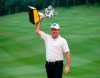 Scott Hend of Australia holds up his trophy after winning the Malaysia Golf Championship in Kuala Lumpur, Malaysia, Sunday, March 24, 2019. (AP Photo/Vincent Phoon)