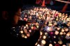 Mourners takes picture of candles, paying respects to the victims of Friday's shooting, outside the Al Noor mosque in Christchurch, New Zealand, Monday, March 18, 2019. Three days after Friday's attack, New Zealand's deadliest shooting in modern history, relatives were anxiously waiting for word on when they can bury their loved ones. (AP Photo/Vincent Thian)