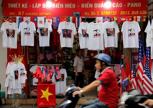 T-shirts featuring prints of U.S. President Donald Trump and North Korean leader Kim Jong Un are displayed in a tourist area Thursday, Feb. 28, 2019, in Hanoi, Vietnam. (AP Photo/Vincent Yu)