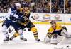 Michael Dwyer / The Associated Press
Boston Bruins' Tuukka Rask deflects the shot as the Bruins' Andrew Ference defends against Winnipeg Jets' Kyle Wellwood in the first period of their NHL game in Boston Tuesday.