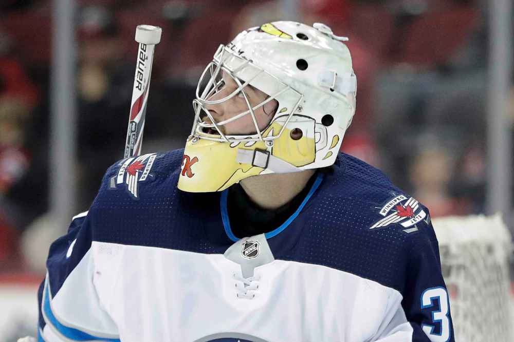 (AP Photo/Julio Cortez)
Winnipeg Jets emergency goalie Zane Kalemba warms up ahead of an NHL hockey game against the New Jersey Devils, Thursday, March 8, 2018, in Newark, N.J.