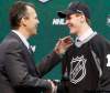Eric Miller / REUTERS
General manager Kevin Cheveldayoff shakes hands with first round pick Mark Scheifele at the 2011 NHL hockey draft in St. Paul, Minnesota,  June 24, 2011.