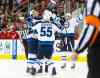 USA Today Sports
James Guillory / USA TODAY Sports
Winnipeg's Chris Thorburn (left) is swarmed by teammates after potting the winning goal with 63 seconds remaining at PNC Arena. The Jets won for the ninth time in 11 starts under head coach Paul Maurice.