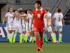 USA' players celebrate a goal by teammate Carli Lloyd (10) as China's Han Peng (18) walks away during second half FIFA Women's World Cup quarter-final soccer action against China in Ottawa on Friday, June 26, 2015. THE CANADIAN PRESS/Adrian Wyld