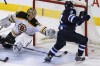JOHN WOODS / WINNIPEG FREE PRESS
The Jets’ Evander Kane pots the winner against Bruins goaltender Tuukka Rask in the third period at the MTS Centre Tuesday