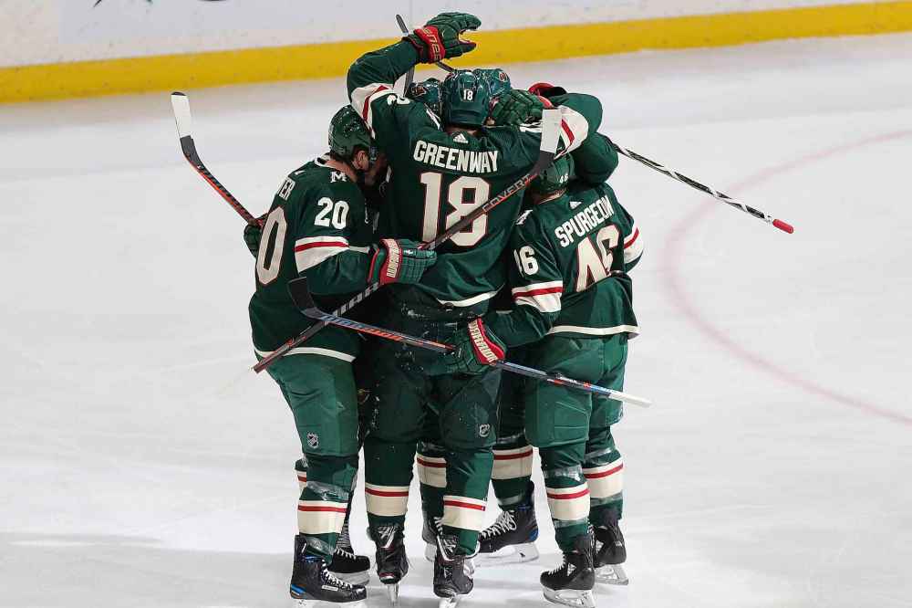 (AP Photo/Stacy Bengs)
Minnesota Wild's Jordan Greenway celebrates with teammates after scoring against the Winnipeg Jets in the first period Thursday in St. Paul, Minn.