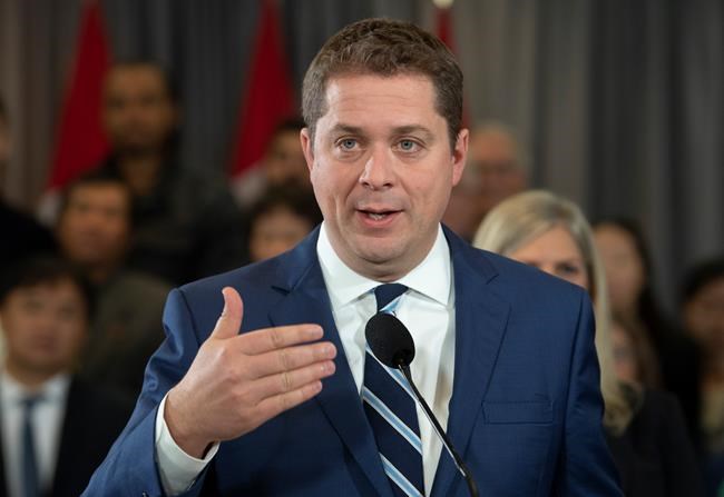 Conservative leader Andrew Scheer responds to questions from the media during a campaign stop in Toronto. Saturday, October 19, 2019. THE CANADIAN PRESS/Adrian Wyld