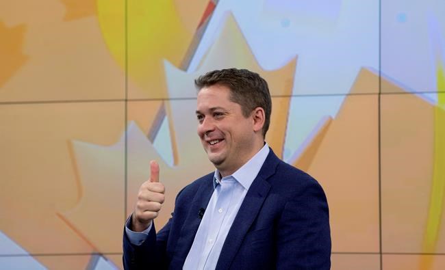 Conservative Leader Andrew Scheer gives a thumbs up to members of the public outside a television studio in Toronto, Thursday October 17, 2019. THE CANADIAN PRESS/Adrian Wyld