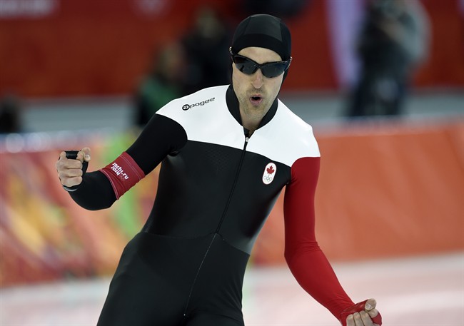 Canada's Denny Morrison celebrates on Saturday February 15, 2014 in Sochi, Russia. THE CANADIAN PRESS/Adrian Wyld