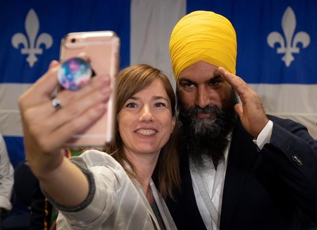 NDP leader Jagmeet Singh poses with a supporter after speaking during a campaign stop in Sherbrooke, Que., Sunday, September 15, 2019. THE CANADIAN PRESS/Adrian Wyld