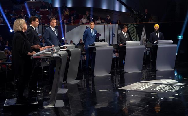 Green Party leader Elizabeth May, left, responds to a question as Liberal leader Justin Trudeau, left to right, Conservative leader Andrew Scheer, People's Party of Canada leader Maxime Bernier, Bloc Quebecois leader Yves-Francois Blanchet and NDP leader Jagmeet Singh look on during the Federal leaders debate in Gatineau, Que. on Monday, October 7, 2019. THE CANADIAN PRESS/Sean Kilpatrick