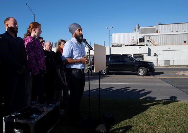 With the General Motors plant as a backdrop, NDP leader Jagmeet Singh speaks during a campaign announcement in Oshawa, Ont. Saturday September 14, 2019. THE CANADIAN PRESS/Adrian Wyld