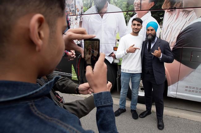 NDP leader Jagmeet Singh poses for photographs with supporters following a campaign stop in Brampton, Ont., Thursday, September 12, 2019. Question-and-answer sessions with reporters are nothing new on the campaign trail — but Jagmeet Singh's Punjabi exchange today makes clear the growing influence of Canada's South Asian community in key battleground ridings. THE CANADIAN PRESS/Adrian Wyld