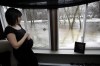 JOE BRYKSA / WINNIPEG FREE PRESS
A pregnant Amanda Chopp watches water rise in the rear of her home near Lorette.