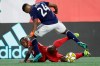 Toronto FC midfielder Richie Laryea, below, and New England Revolution forward DeJuan Jones (24) compete for the ball during the first half of an MLS soccer match at Gillette Stadium, Saturday, Aug. 31, 2019, in Foxborough, Mass. The match ended in a 1-1 tie. (AP Photo/Elise Amendola)