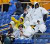 Boris Minkevich / Winnipeg Free Press
These Bomber fans were ready for the rain prior to kickoff.
