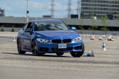 Kelly takes the BMW 435i through the short autocross course at BMW Driving Experience.