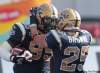 JOE.BRYKSA@FREEPRESS.MB.CA
Winnipeg Blue Bomber Moton Hopkins, left,  is congratulated by teammate Brady Browne after running the ball in after it was stripped from  Edmonton Eskimos Rick Ray during first quarter CFL action at Canad Inns Stadium in Winnipeg Saturday afternoon.