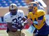 KEN GIGLIOTTI / WINNIPEG FREE PRESS
Buck Pierce hands off to Fred Reid in practice Monday afternoon. The Bombers host Toronto Friday night.