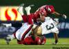 Jeff McIntosh / THE CANADIAN PRESS
Winnipeg Blue Bombers quarterback Steven Jyles, centre, gets sacked by Calgary Stampeders Juwan Simspon, top, and Malik Jackson during third quarter CFL football action in Calgary, Saturday.