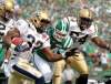 Mark Taylor / the canadian press
Winnipeg Blue Bombers running back Fred Reid runs the ball against the Saskatchewan Roughriders during the CFL first-half action in Regina Sunday, September 5, 2010.