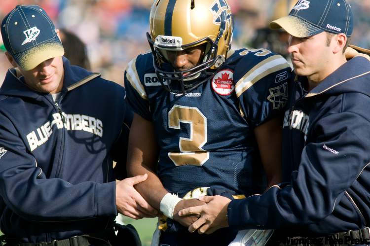 DAVID LIPNOWSKI / WINNIPEG FREE PRESS
Winnipeg Blue Bombers QB Steven Jyles is helped off the field after an injury took him out of the game against the Toronto Argonauts Saturday afternoon at Canad Inns Stadium.