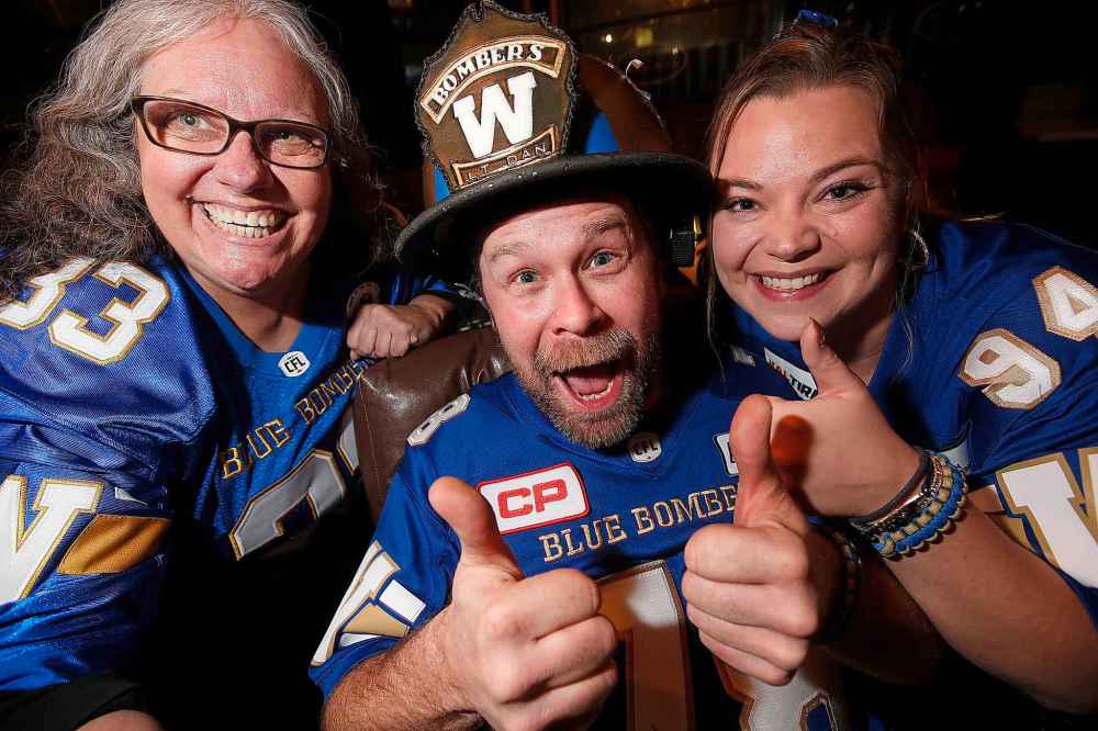 JOHN WOODS / WINNIPEG FREE PRESS
From left, Claudia Byczek, Dan LeBlanc, aka Lt Dan, and Fraser Olson who are leaving for Calgary tomorrow to support the Winnipeg Blue Bombers in the Grey Cup.