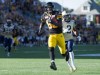 Peter Power / The Canadian Press 
Ticats receiver Terrence Toliver leaves the Bombers' Matt Bucknor in his dust on the way to the end zone.