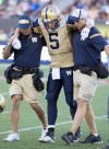 CP
Winnipeg Blue Bombers quarterback Drew Willy is assisted off of the field after he was injured during the second half of Sunday's game in Hamilton.