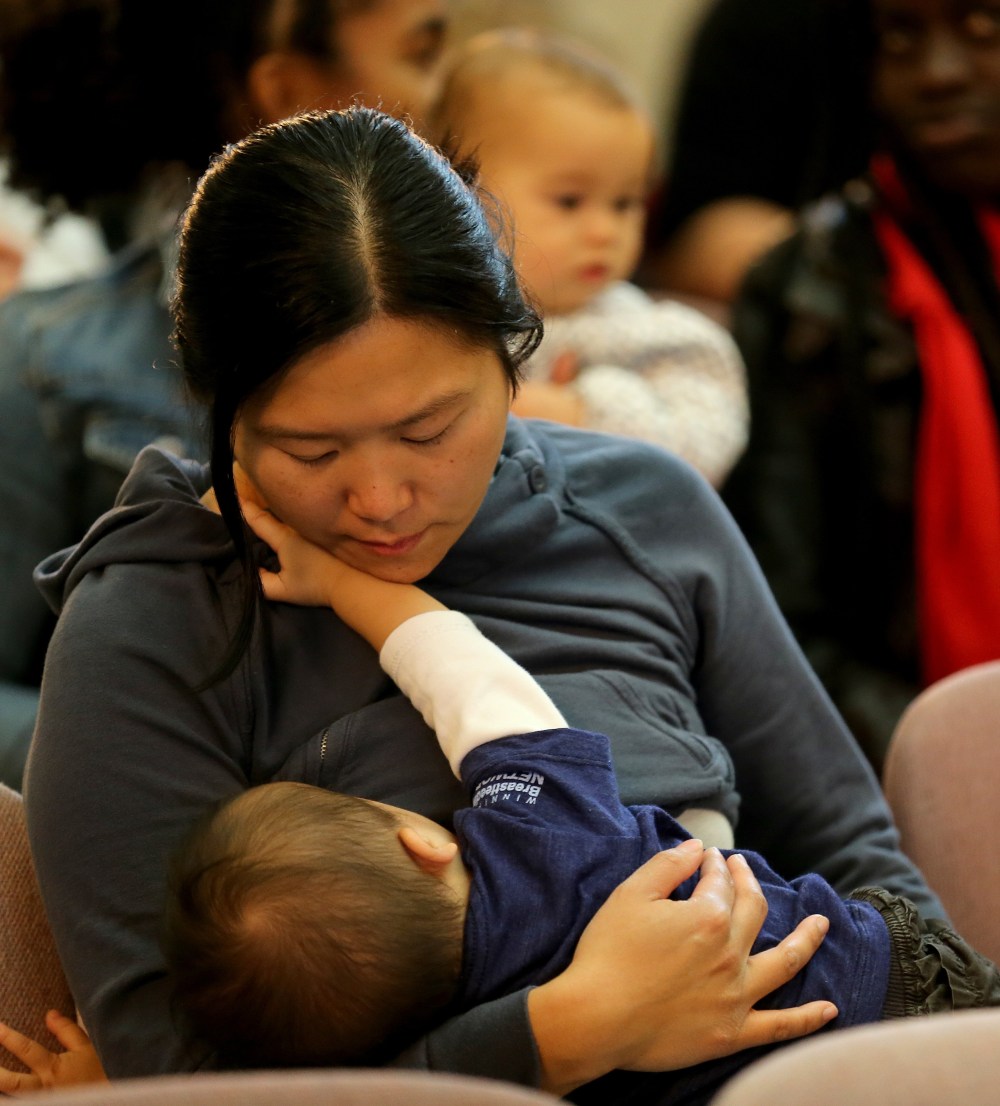 Mothers breastfeed little ones at the Legislature Winnipeg Free Press