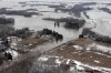 Breezy Point Road is left submerged Sunday after several shifts in the ice jam north of Selkirk forced river water to inundate dozens of homes in the RMs of St. Andrews and St. Clements.