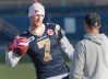JOE.BRYKSA@FREEPRESS.MB.CA 
Winnipeg Blue Bombers quarterback Alex Brink, left, during a light practice Sunday morning at Canad Inns Stadium as the Bomb Squad prepares to face the B.C. Lions on Monday.