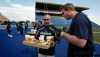 PHIL.HOSSACK@FREEPRESS.MB.CA 
Doug Brown (right) raised his eyebrows when Mike Kelly served Booster Juices to veterans at Bombers practice. But the stunt also raised Brown’s spirits.