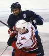 TREVOR HAGAN / WINNIPEG FREE PRESS
Winnipeg Jets' Dustin Byfuglien bumps Carolina Hurricanes' Drayson Bowman Saturday at the MTS Centre. The defenceman averages more than 24 minutes per game.
