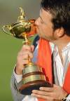KIERAN DOHERTY / REUTERS ARCHIVES
U.S. Open champion Graeme McDowell kisses the Ryder Cup after helping the Europeans defeat the U.S. team.