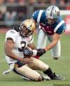 PAUL CHIASSON / THE CANADIAN PRESS
Blue Bombers QB Steven Jyles (3) is hauled down by his helmet by Montreal Alouettes linebacker Chip Cox during Sunday’s 22-19 Bomber loss.
