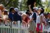 TREVOR HAGAN / WINNIPEG FREE PRESS
Michelle Wie (right) waves to emergency personnel after a man fainted Thursday.
