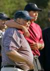 MARK J. TERRILL / THE ASSOCIATED PRESS ARCHIVES
Tiger Woods hugs his father, Earl, after win at Target World Challenge in 2004.