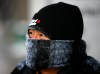 Larry MacDougal / THE CANADIAN PRESS
Conrad Yun struggles to stay warm in frigid temperatures, with a wind chill of -30 C as he travels through downtown Calgary Monday.