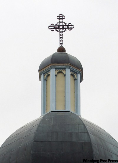 One way to easily distinguish the two types of churches is by their crosses. The Ukrainian Catholic cross atop its domes is just the regular pole stake and one cross piece.