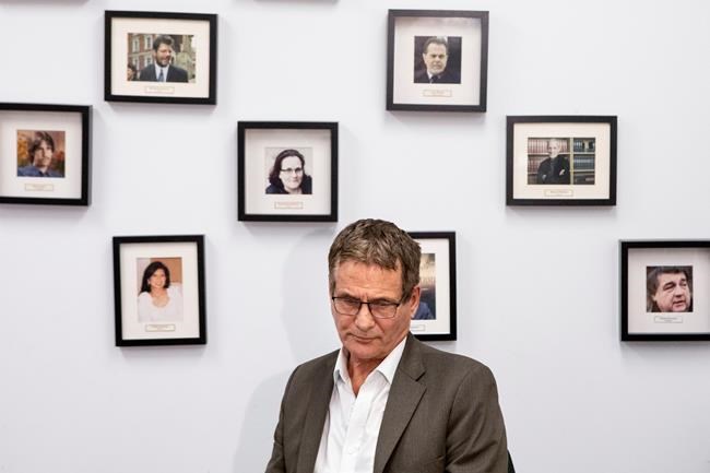 David Milgaard, who spent 23 years in prison after being wrongfully convicted of murder, is seated in front of photos of other people who have suffered wrongful convictions, during a press conference held by Innocence Canada, in Toronto, on Wednesday October 10, 2019. The advocacy group has announced that the country's major federal parties have committed to creating a special tribunal to investigate wrongful convictions. THE CANADIAN PRESS/Chris Young